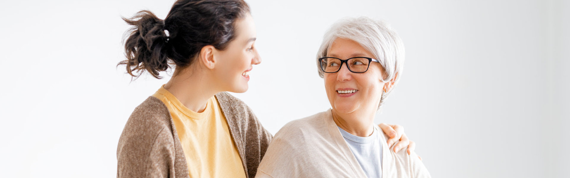 A female and a senior woman looking at each other